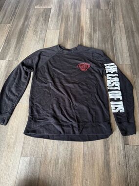 Universal Black Long-Sleeve Shirt with White Sleeve Text and Red Chest Logo